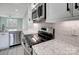 Stainless steel appliances and granite countertops highlight this modern kitchen at 2866 15Th Avenue Se Pl, Hickory, NC 28602