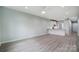 Open living room with kitchen island and modern flooring at 2866 15Th Avenue Se Pl, Hickory, NC 28602