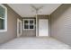 Covered patio with ceiling fan, access door, and windows at 2866 15Th Avenue Se Pl, Hickory, NC 28602