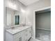 Double vanity bathroom with granite countertop and large mirror at 2870 15Th Avenue Se Pl, Hickory, NC 28602