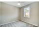 Bright bedroom with window and ceiling fan at 2870 15Th Avenue Se Pl, Hickory, NC 28602