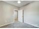 Bedroom with open door to hallway at 2870 15Th Avenue Se Pl, Hickory, NC 28602