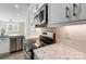 Stainless steel appliances and granite countertops in this modern kitchen at 2870 15Th Avenue Se Pl, Hickory, NC 28602