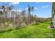 Landscaped backyard with green grass and wooded backdrop at 2870 15Th Avenue Se Pl, Hickory, NC 28602