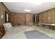 Spacious basement area with brick accents, lattice walls, and abundant space for various activities and storage at 715 Saint Cloud Dr, Statesville, NC 28625