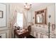 Bright bathroom features a vanity with ample counter space, stylish fixtures, and window providing natural light at 715 Saint Cloud Dr, Statesville, NC 28625