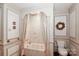 Well-designed bathroom with a shower/tub combo, classic fixtures, and decorative elements that enhance its charm at 715 Saint Cloud Dr, Statesville, NC 28625