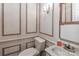 Classic powder room featuring neutral tones, detailed trim work, and modern fixtures for a functional and stylish space at 715 Saint Cloud Dr, Statesville, NC 28625