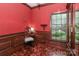 Inviting den with wood accents, chair, and natural light streaming through the window at 715 Saint Cloud Dr, Statesville, NC 28625