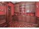 Cozy den with wood paneling, built-in cabinetry, and a view of the lush yard at 715 Saint Cloud Dr, Statesville, NC 28625