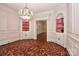 Charming dining room with built-in shelves, chandelier, and detailed trim work at 715 Saint Cloud Dr, Statesville, NC 28625