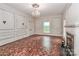 Bright living room featuring a fireplace, chandelier, and classic architectural details at 715 Saint Cloud Dr, Statesville, NC 28625