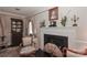 Cozy living room with fireplace, ornate details, and elegant furnishings for a comfortable and stylish gathering space at 715 Saint Cloud Dr, Statesville, NC 28625