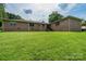 Large backyard with lush, green lawn, offering ample space for recreation and relaxation at 370 21St Nw Ave, Hickory, NC 28601