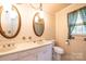 Bathroom featuring dual sinks, vintage wallpaper, vanity lighting and linoleum floors at 370 21St Nw Ave, Hickory, NC 28601