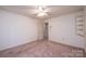 Bright bedroom featuring neutral walls, carpet floors, and a built-in corner shelf at 370 21St Nw Ave, Hickory, NC 28601