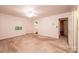 Large bedroom featuring striped wallpaper, dual windows and carpeted flooring at 370 21St Nw Ave, Hickory, NC 28601