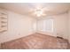 Bedroom with tan carpeting, ceiling fan, closet and natural lighting at 370 21St Nw Ave, Hickory, NC 28601