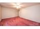 Bright bedroom with carpeted flooring and a view to another room at 370 21St Nw Ave, Hickory, NC 28601