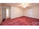 Large bedroom with carpeted flooring and a view to another room at 370 21St Nw Ave, Hickory, NC 28601