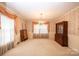 Formal dining room featuring wallpaper, carpet, traditional chandelier, and built-in hutch at 370 21St Nw Ave, Hickory, NC 28601