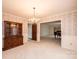 Spacious formal dining room with a chandelier, carpet, and easy access to adjacent rooms at 370 21St Nw Ave, Hickory, NC 28601