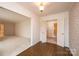 Spacious dining room featuring tile and carpet floors, neutral walls, and decorative lighting fixtures at 370 21St Nw Ave, Hickory, NC 28601