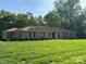Charming single-story brick home with a manicured lawn, mature trees, and welcoming curb appeal at 370 21St Nw Ave, Hickory, NC 28601