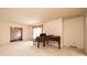 Cozy living room with plush carpeting, a piano, and view to the dining area at 370 21St Nw Ave, Hickory, NC 28601