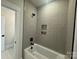 Stylish bathroom with a modern shower and tub, featuring elegant tiling and black fixtures at 4379 Morning Mist Dr # 12, Sherrills Ford, NC 28673