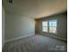 Spacious bedroom with new carpeting, large windows offering a view at 4379 Morning Mist Dr # 12, Sherrills Ford, NC 28673