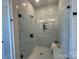 Contemporary shower featuring marble-style tiling, a glass door, and stylish fixtures at 4379 Morning Mist Dr # 12, Sherrills Ford, NC 28673