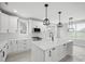 Bright kitchen featuring an island, modern lighting, stainless steel appliances, and white cabinetry at 117 Hatford Ct, Statesville, NC 28625