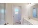 Modern bathroom with a white vanity, chrome hardware, and tiled floors at 4061 Lawnview Dr, Charlotte, NC 28269
