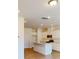 Bright kitchen with white cabinets, stainless steel appliances, and a central island at 4061 Lawnview Dr, Charlotte, NC 28269