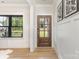 Bright entryway with wood floors, craftsman trim, a wooden front door, and a large window at 171 Heartland Dr # 7, Rock Hill, SC 29732