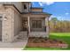 Charming covered front porch with stone pillars and iron railing, offering a welcoming entrance to the home at 171 Heartland Dr # 7, Rock Hill, SC 29732