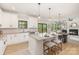 Eat-in kitchen with quartz countertops, modern island seating, and a clear view into the living room with a fireplace at 171 Heartland Dr # 7, Rock Hill, SC 29732