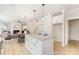 Open kitchen with a center island, seamlessly blending with the living area and fireplace for a cozy, modern living space at 171 Heartland Dr # 7, Rock Hill, SC 29732