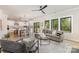Inviting living room boasts natural light, hardwood floors, and views of the outdoor deck through sliding glass doors at 171 Heartland Dr # 7, Rock Hill, SC 29732