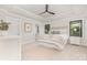 Bright main bedroom features tray ceilings, neutral walls, carpet, and black trimmed windows at 171 Heartland Dr # 7, Rock Hill, SC 29732