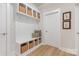 Well-organized mudroom with built-in bench, storage cubbies, coat hooks, and decorative accents at 171 Heartland Dr # 7, Rock Hill, SC 29732