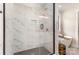 The spa-like shower features white marble and a dark grey base for luxury and relaxation at 171 Heartland Dr # 7, Rock Hill, SC 29732