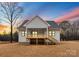 White farmhouse with back deck and stairs leading to the backyard at 199 Heartland Dr # 10, Rock Hill, SC 29732