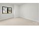 Bright bedroom with a large window offering a view of the outdoors at 199 Heartland Dr # 10, Rock Hill, SC 29732