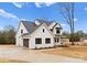 Elegant two-story white farmhouse-style home with a two car garage and freshly planted landscaping at 199 Heartland Dr # 10, Rock Hill, SC 29732
