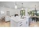 Modern kitchen with white cabinets, quartz countertops, stainless steel appliances, and an open view of the living area at 199 Heartland Dr # 10, Rock Hill, SC 29732