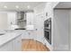 Modern kitchen with white cabinetry, stainless steel appliances, and wood floors at 199 Heartland Dr # 10, Rock Hill, SC 29732