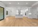 Spacious open-concept kitchen with white cabinets, stainless steel appliances, and island with sink at 199 Heartland Dr # 10, Rock Hill, SC 29732