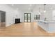 Bright, open-concept living room featuring fireplace and sliding glass doors to a deck at 199 Heartland Dr # 10, Rock Hill, SC 29732
